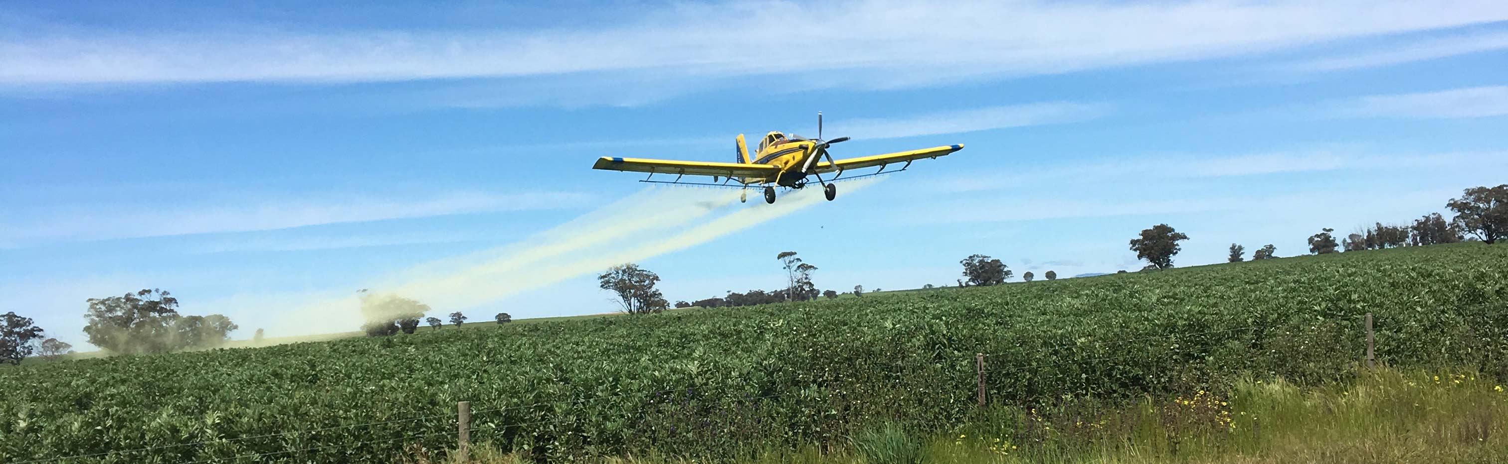 AG Airwork img of plane spraying crops